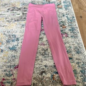 pink athleta girl leggings, pockets on the sides
